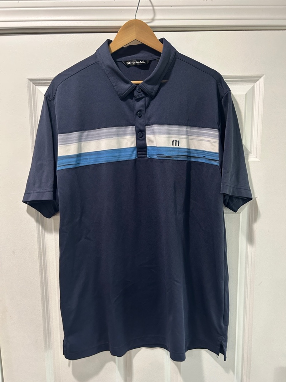Travis Mathew Navy Polo with White and Light Blue Stripes